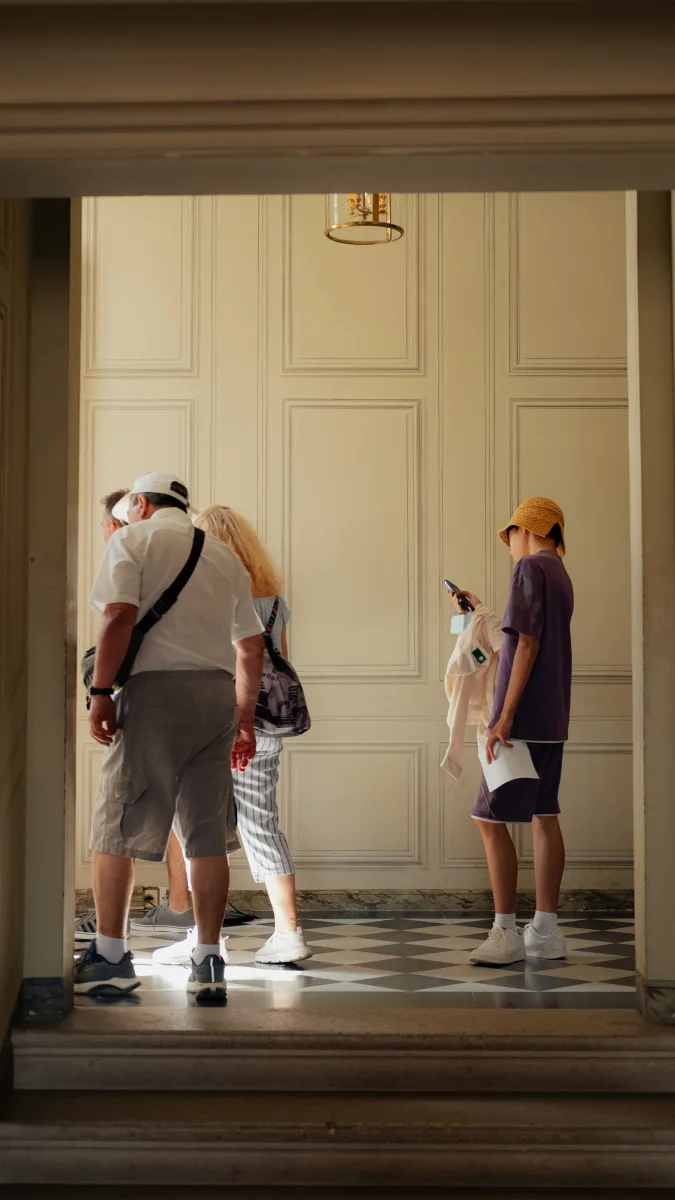 Visitors in a Versailles hallway
